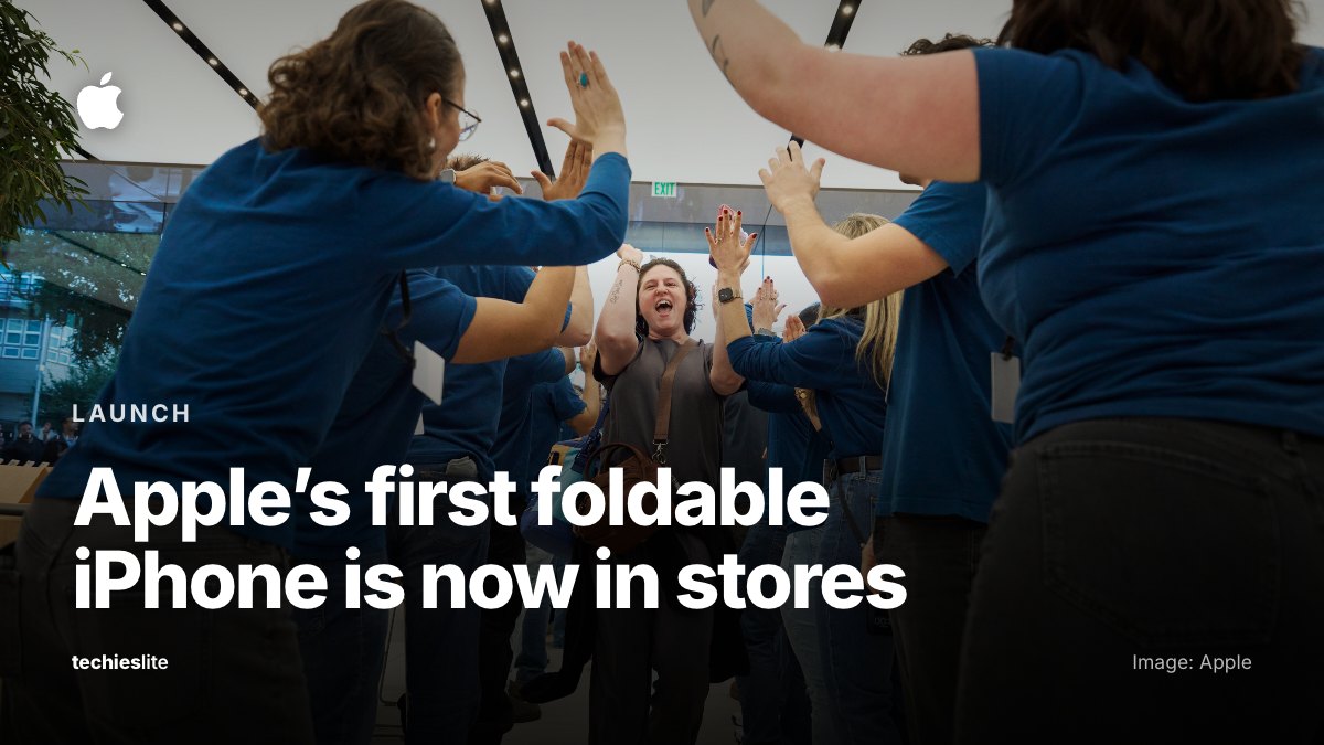 A customer walks between two rows of Apple Store employees who cheer and high-five her at Apple Domain Northside in Austin on iPhone Duo launch day